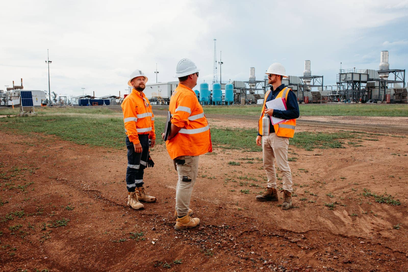Three Fencepac staff talking on site at a gas facility