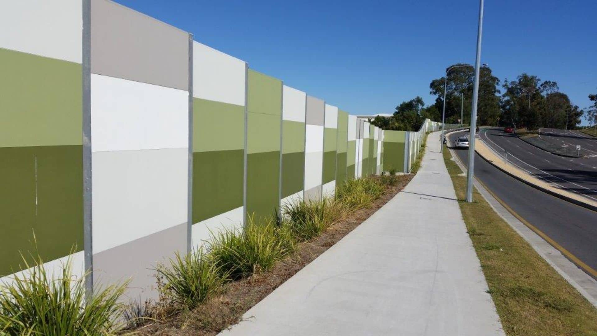 Decorative coloured noise barrier panels on the Coomera Connector project