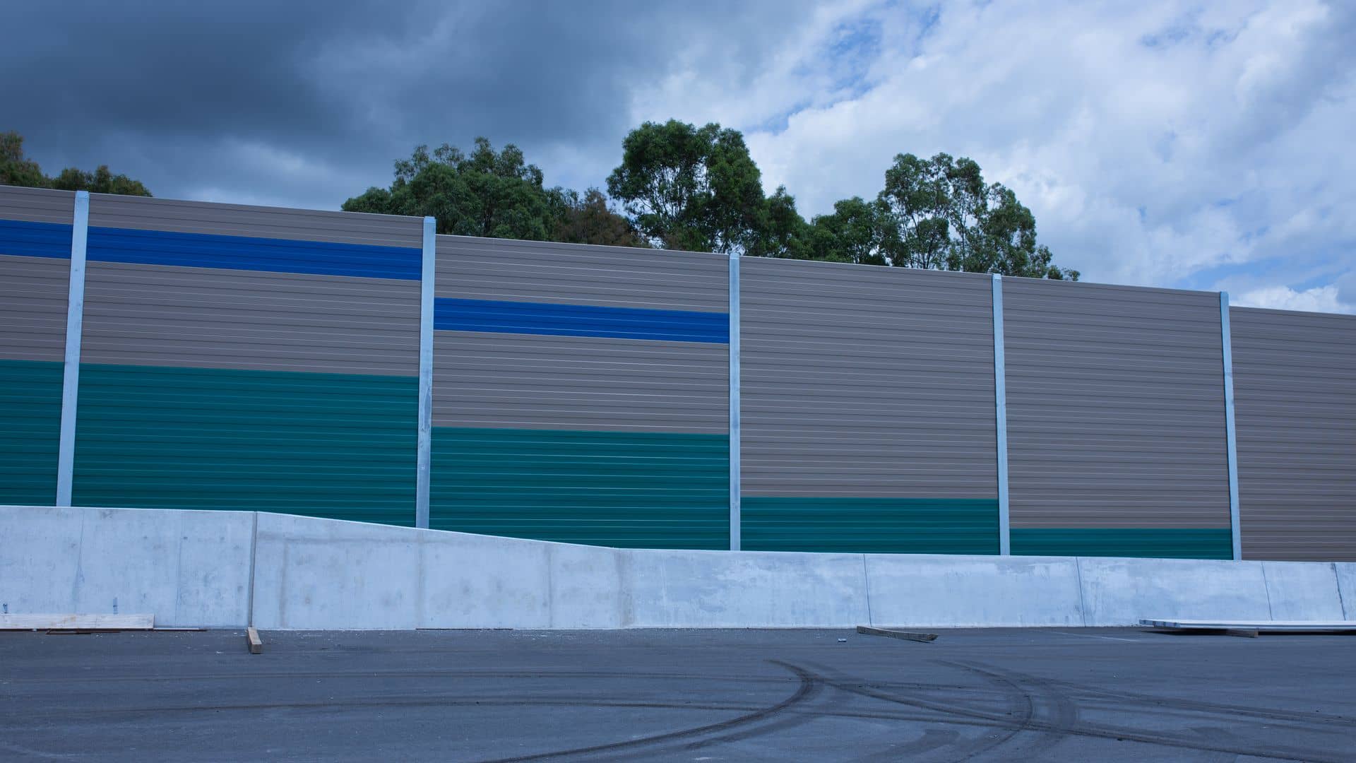 Coloured acoustic noise barrier panels along the Coomera Connector motorway in Queensland