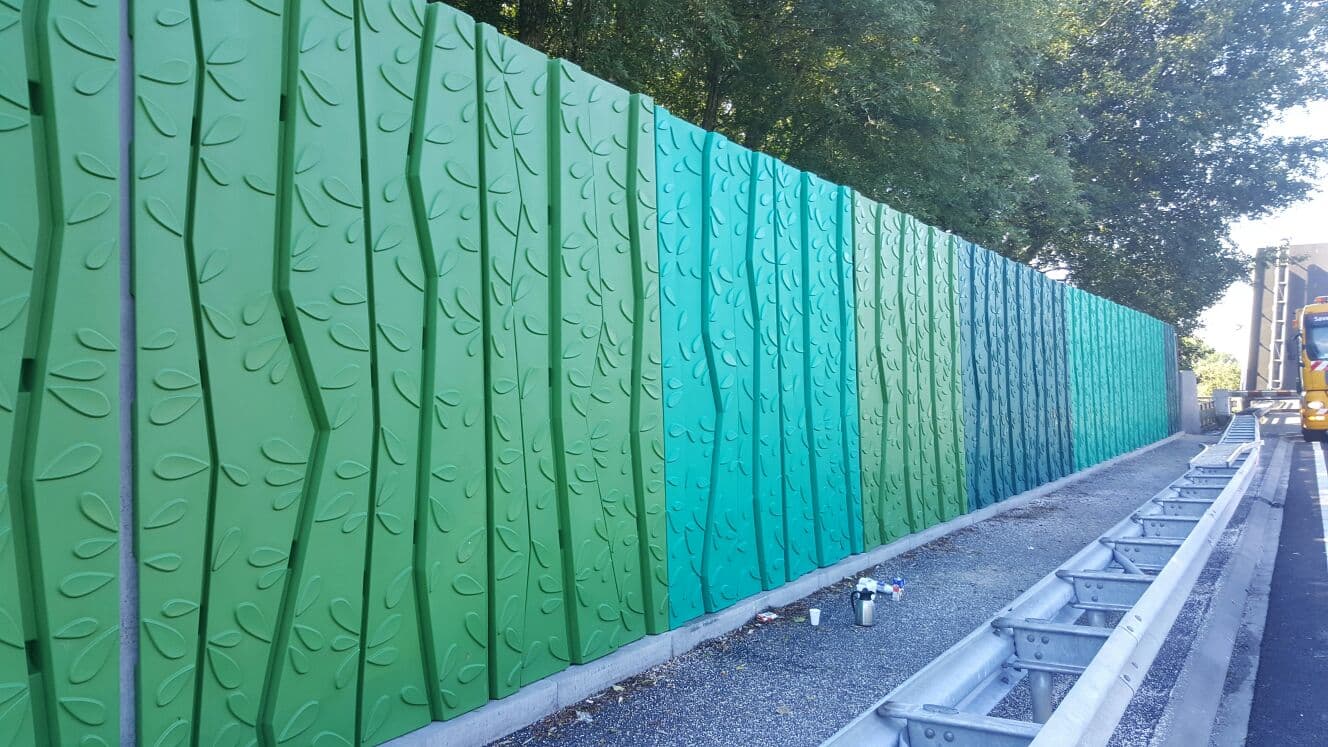 Green and teal embossed decorative RMP Noise Wall panels with leaf texture