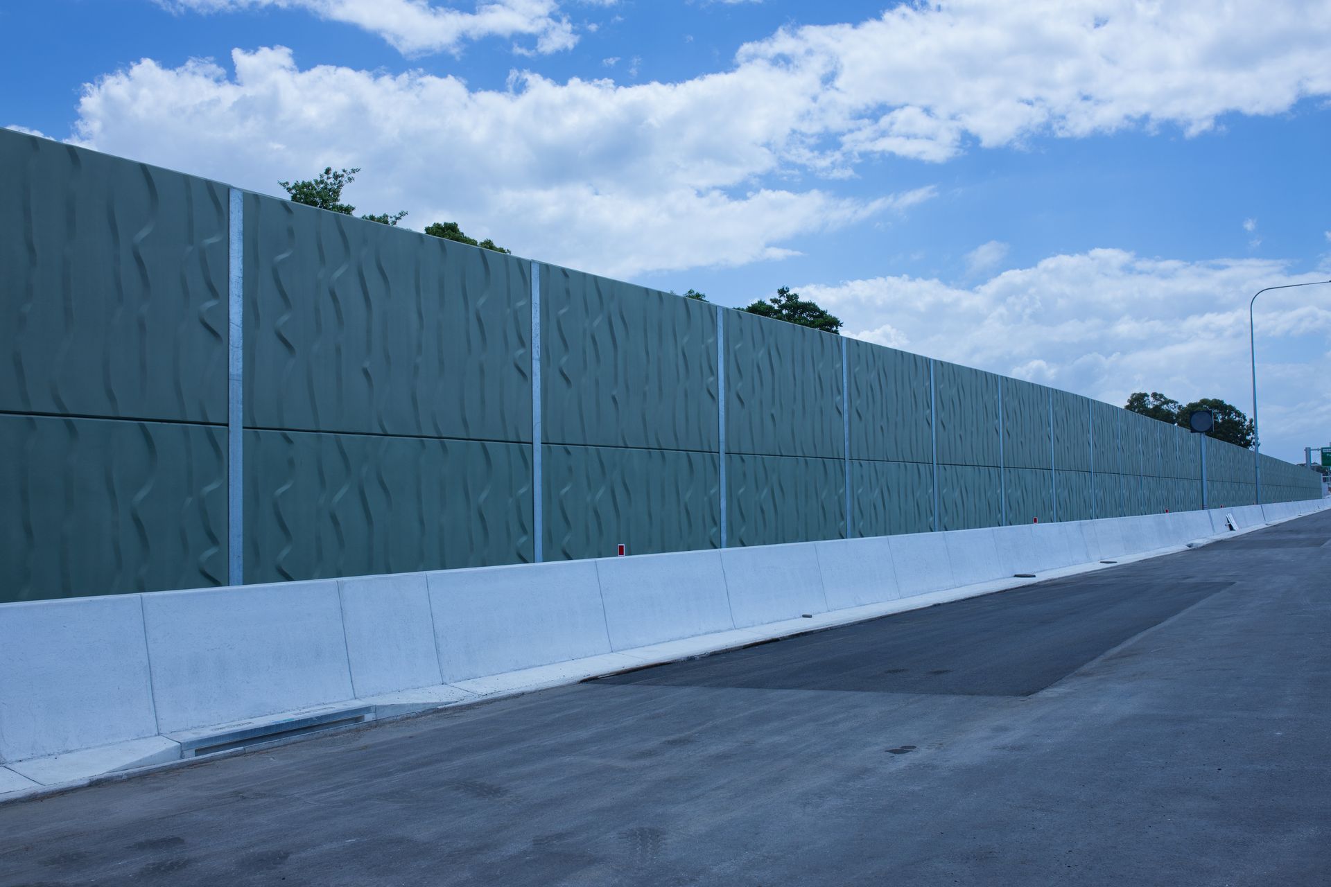 Palm Beach to Tugun textured green concrete noise barrier panels along highway