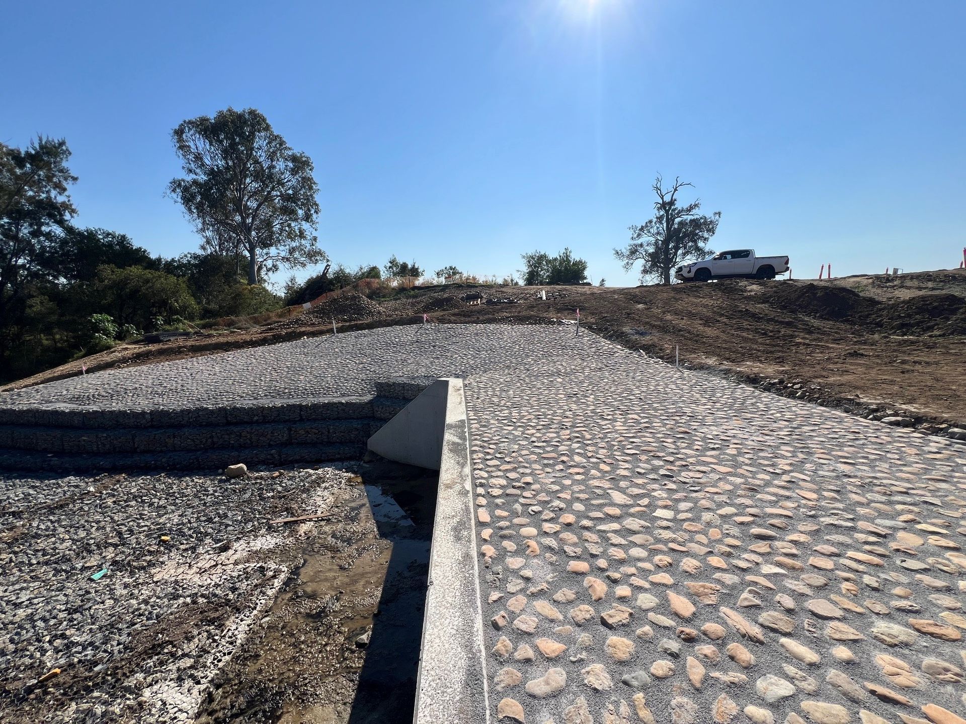 Providence stone pitching slope stabilisation with hand-placed natural stone
